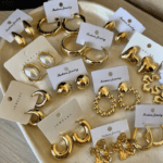 Elegant collection of chunky gold earrings and statement jewelry.