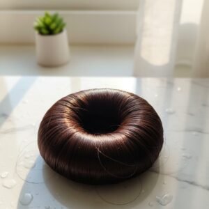 Woman using a black Hair Bun Maker for an elegant updo